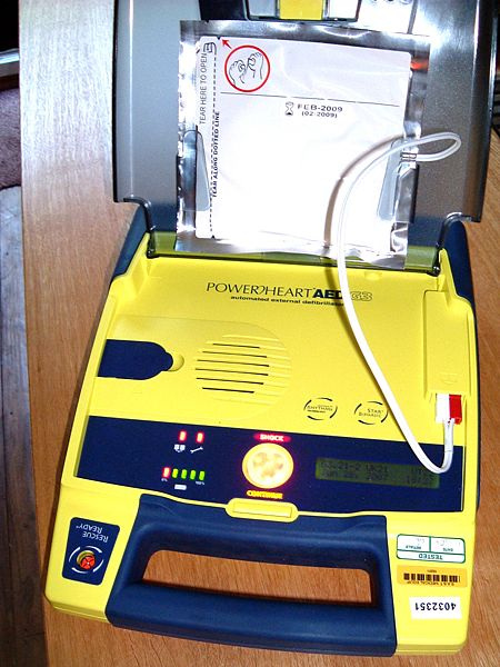 An automated external defibrillator, open and ready for pads to be attached