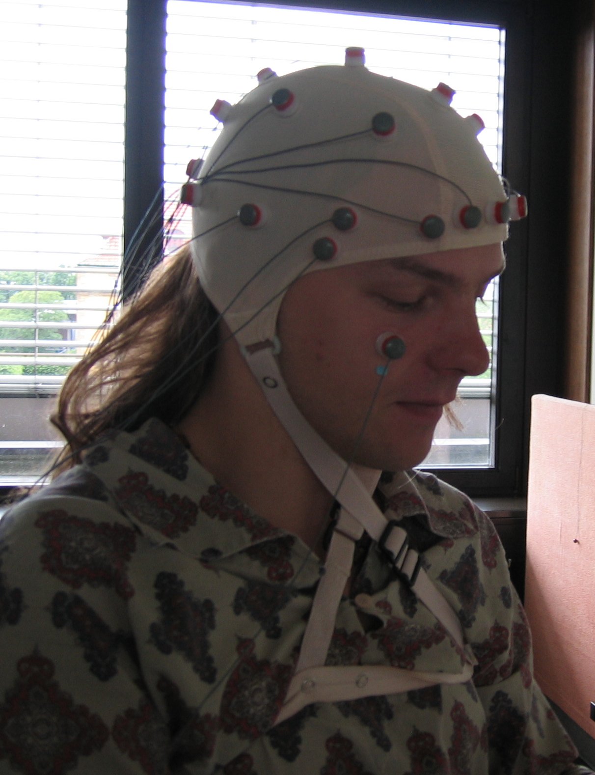Person wearing electrodes for EEG