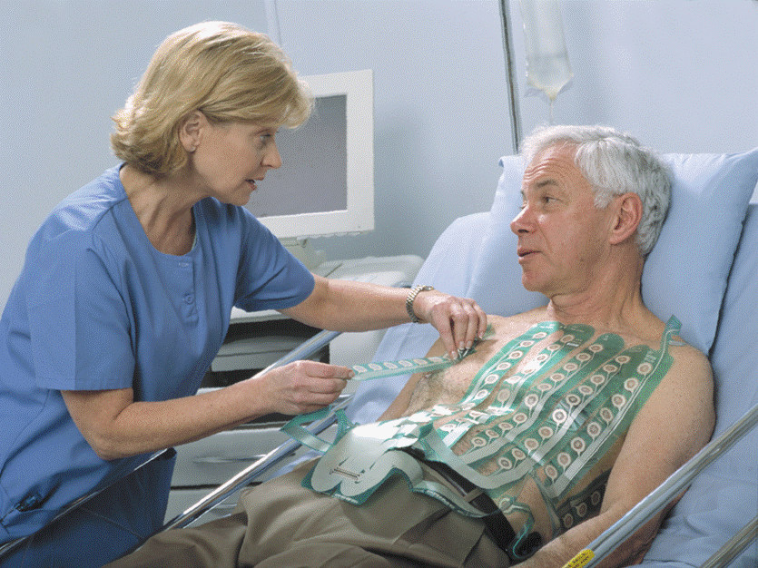 A nurse places an 80 lead EKG on a patient